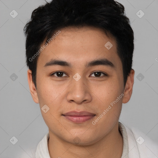 Joyful asian young-adult male with short  brown hair and brown eyes