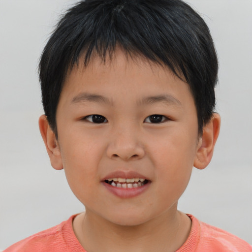 Joyful asian child male with short  brown hair and brown eyes