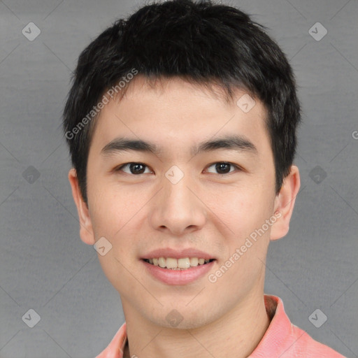 Joyful asian young-adult male with short  brown hair and brown eyes