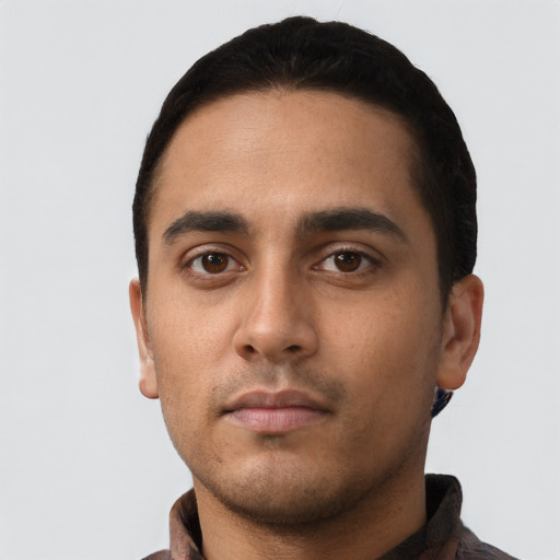 Neutral latino young-adult male with short  black hair and brown eyes