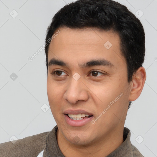 Joyful white young-adult male with short  black hair and brown eyes