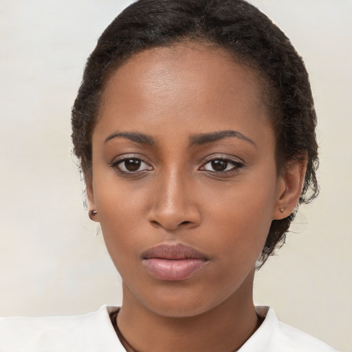 Neutral black young-adult female with short  brown hair and brown eyes