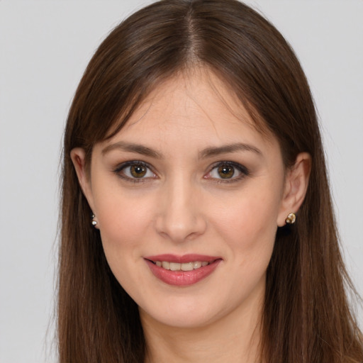 Joyful white young-adult female with long  brown hair and brown eyes