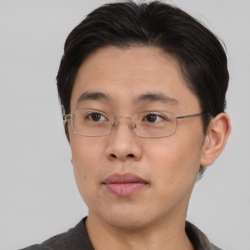 Neutral asian young-adult male with short  brown hair and brown eyes