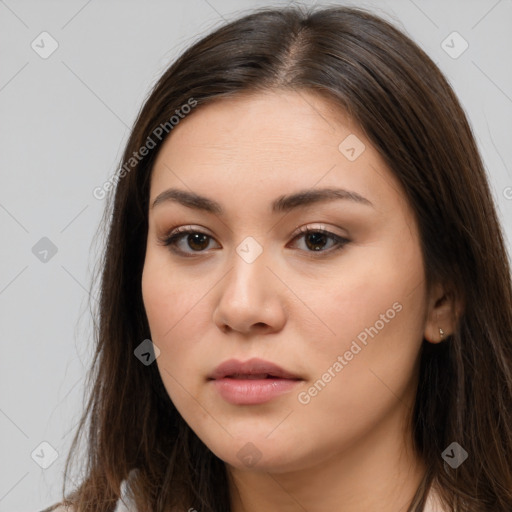 Neutral white young-adult female with long  brown hair and brown eyes