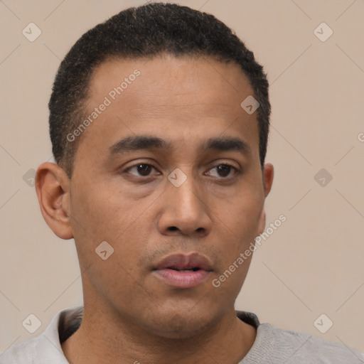 Neutral latino young-adult male with short  black hair and brown eyes