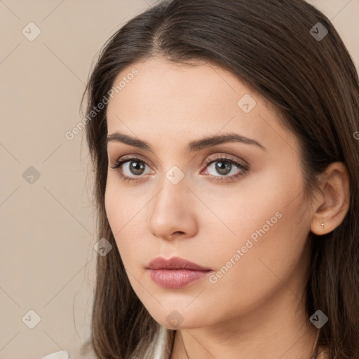 Neutral white young-adult female with long  brown hair and brown eyes