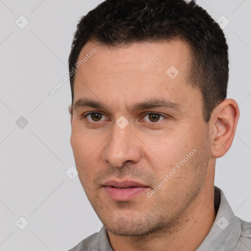 Joyful white young-adult male with short  brown hair and brown eyes