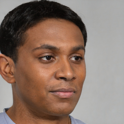 Neutral black young-adult male with short  brown hair and brown eyes