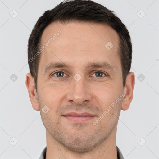 Joyful white adult male with short  brown hair and brown eyes