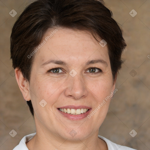 Joyful white adult female with short  brown hair and brown eyes