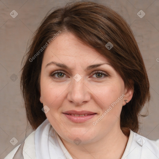 Joyful white adult female with medium  brown hair and brown eyes