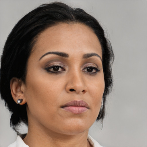 Neutral asian young-adult female with medium  brown hair and brown eyes