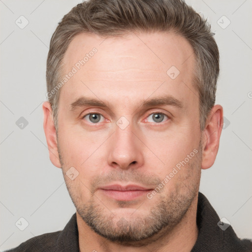 Neutral white adult male with short  brown hair and grey eyes