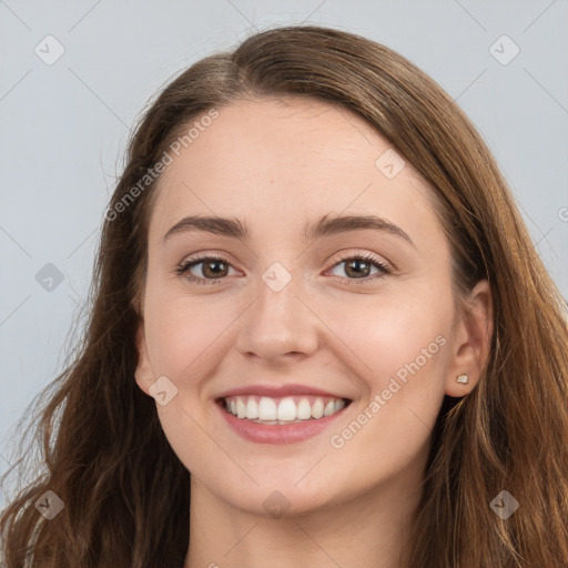 Joyful white young-adult female with long  brown hair and grey eyes