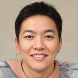 Joyful asian young-adult male with short  brown hair and brown eyes
