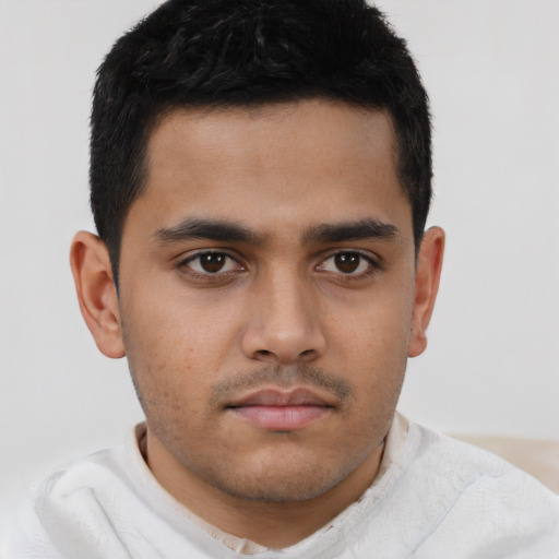 Neutral latino young-adult male with short  brown hair and brown eyes