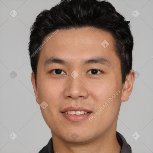 Joyful asian young-adult male with short  black hair and brown eyes