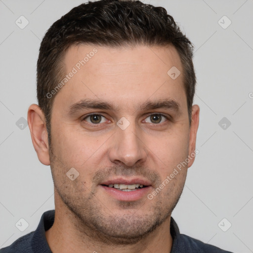 Joyful white young-adult male with short  brown hair and brown eyes