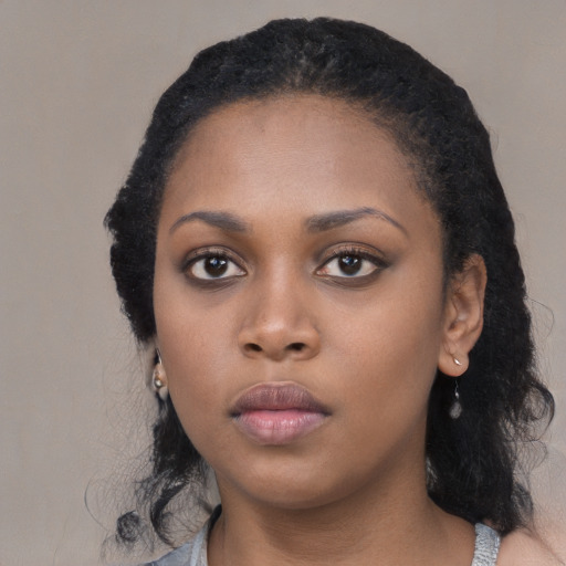Neutral black young-adult female with medium  black hair and brown eyes