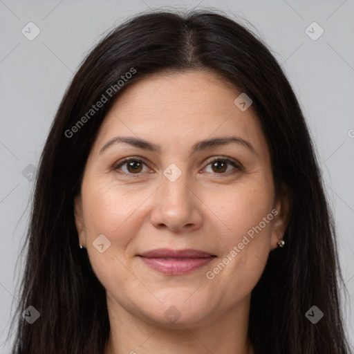 Joyful white adult female with long  brown hair and brown eyes