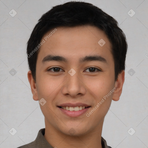 Joyful asian young-adult male with short  black hair and brown eyes