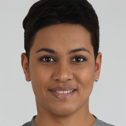 Joyful latino young-adult female with short  black hair and brown eyes