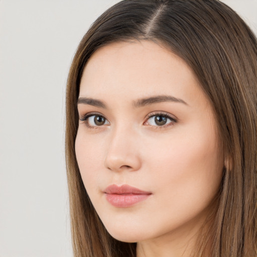 Neutral white young-adult female with long  brown hair and brown eyes