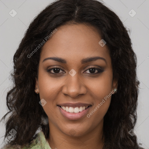 Joyful black young-adult female with long  brown hair and brown eyes