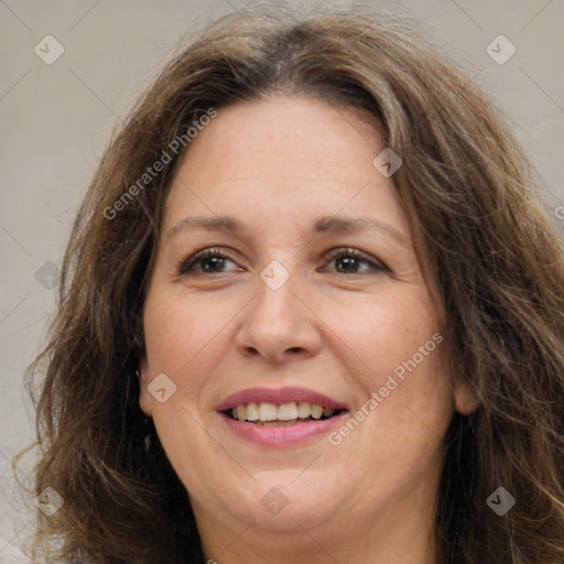 Joyful white adult female with long  brown hair and brown eyes