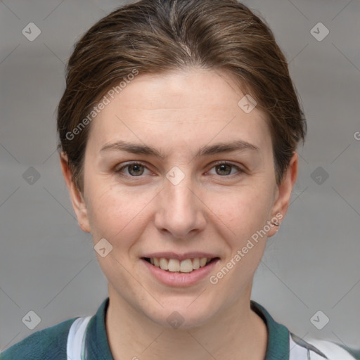 Joyful white young-adult female with short  brown hair and grey eyes