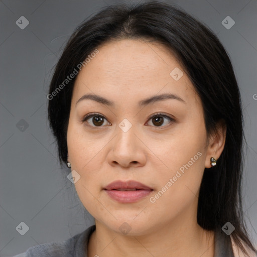 Joyful asian young-adult female with long  brown hair and brown eyes