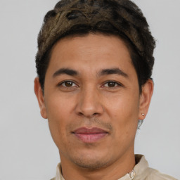 Joyful latino adult male with short  brown hair and brown eyes