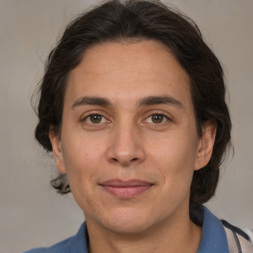 Joyful white adult male with medium  brown hair and brown eyes