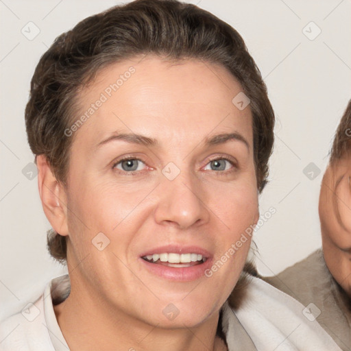 Joyful white adult female with short  brown hair and brown eyes