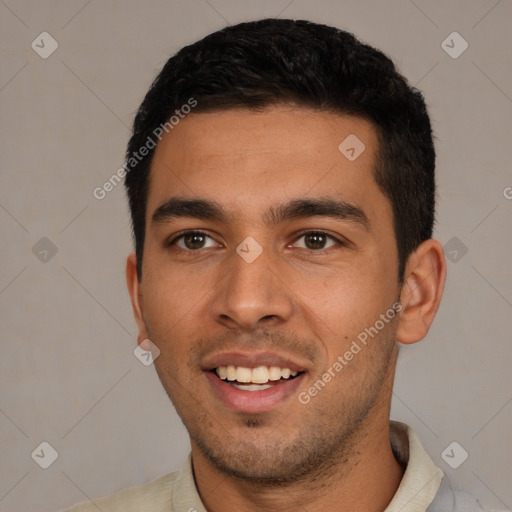 Joyful white young-adult male with short  black hair and brown eyes