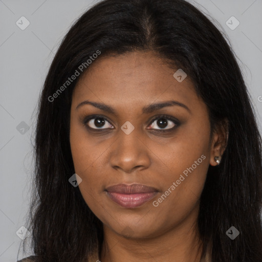 Joyful black young-adult female with long  brown hair and brown eyes