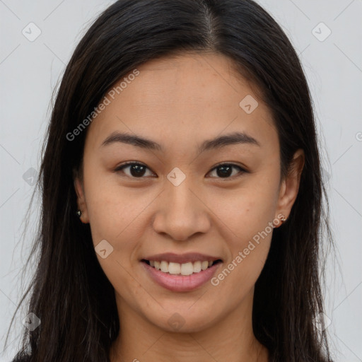 Joyful latino young-adult female with long  brown hair and brown eyes