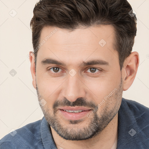 Joyful white young-adult male with short  brown hair and brown eyes