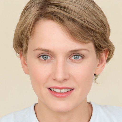 Joyful white young-adult female with medium  brown hair and blue eyes