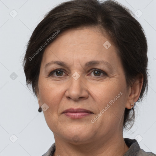 Joyful white adult female with medium  brown hair and brown eyes