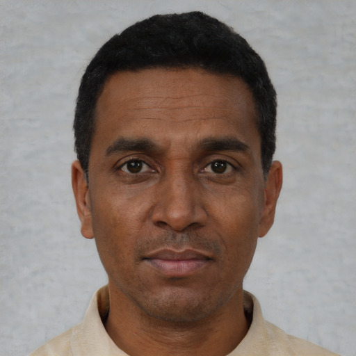 Neutral black adult male with short  black hair and brown eyes