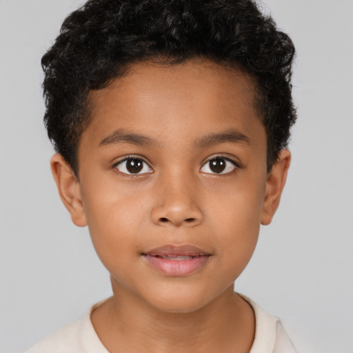 Joyful latino child male with short  brown hair and brown eyes