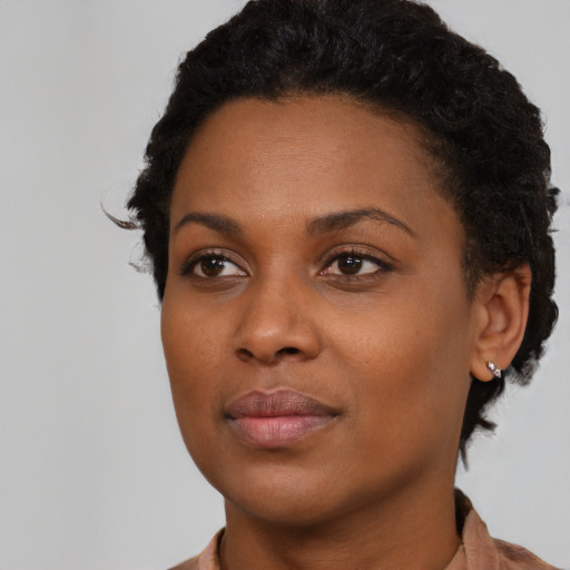 Neutral black young-adult female with short  black hair and brown eyes