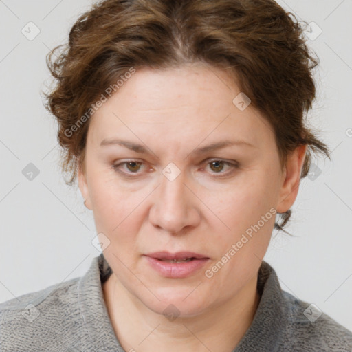 Joyful white adult female with medium  brown hair and blue eyes