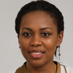 Joyful black young-adult female with short  brown hair and brown eyes