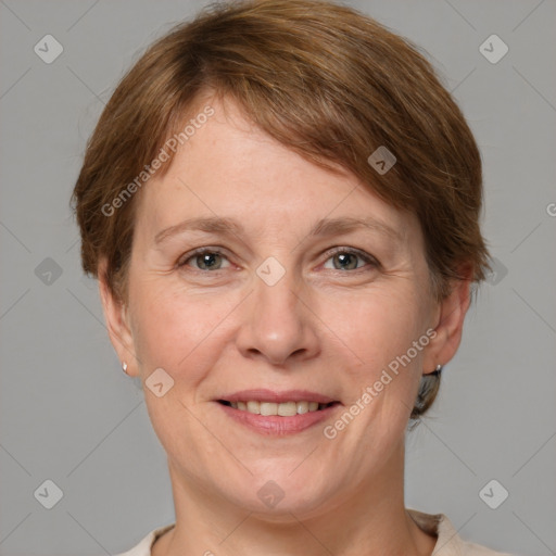 Joyful white adult female with medium  brown hair and grey eyes