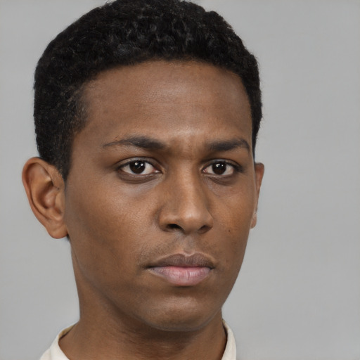 Neutral black young-adult male with short  brown hair and brown eyes
