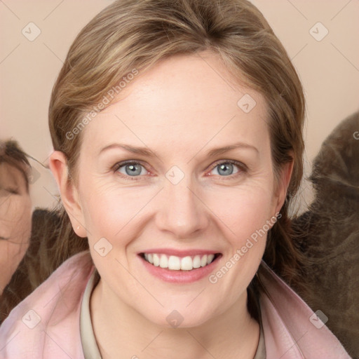 Joyful white young-adult female with medium  brown hair and blue eyes