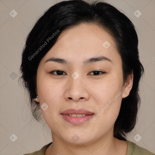 Joyful asian young-adult female with medium  black hair and brown eyes